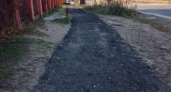 В Дзержинске на разбитой улице Щорса закатали в асфальт новые тротуары